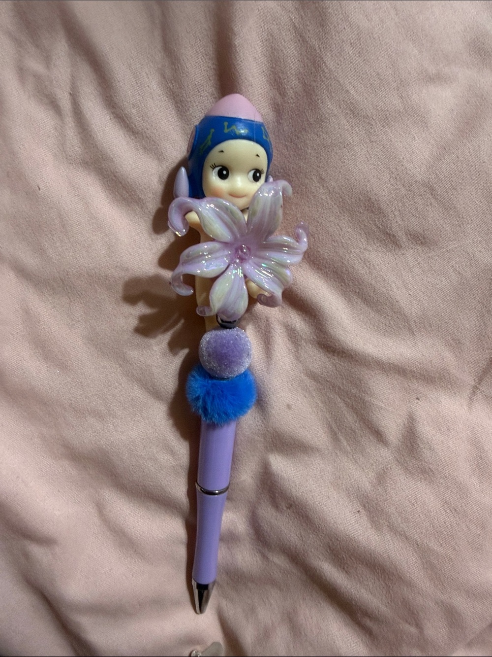 Purple & blue Sonny Angel with flower.  Extra pen refill included